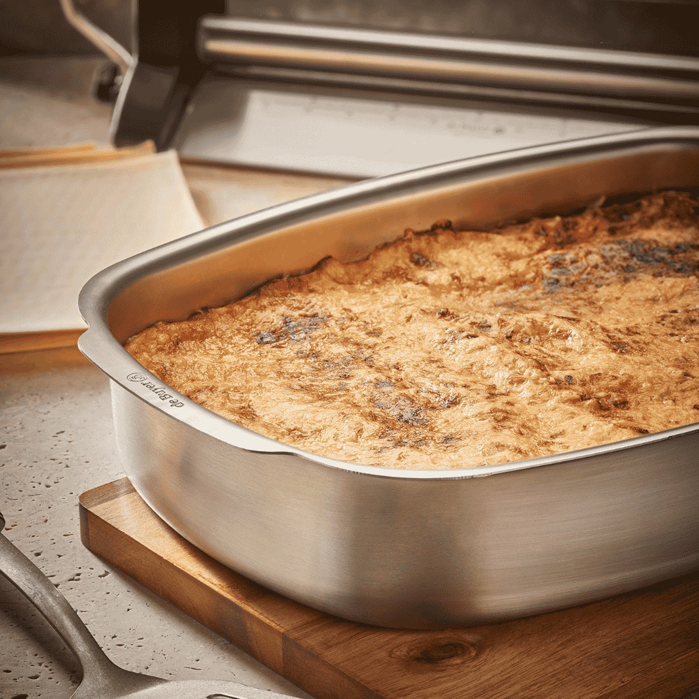 De Buyer Stainless Steel Roasting Pan Set with utensils and ingredients