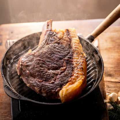 Skeppshult grill pan with walnut handle, made from heavy-duty cast iron for even heat distribution